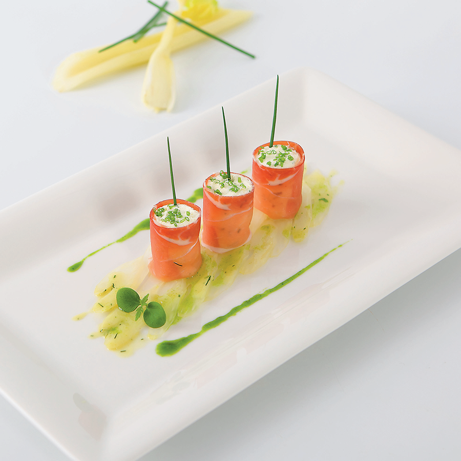 Mascarpone mousse wrapped in bacon on celery salad