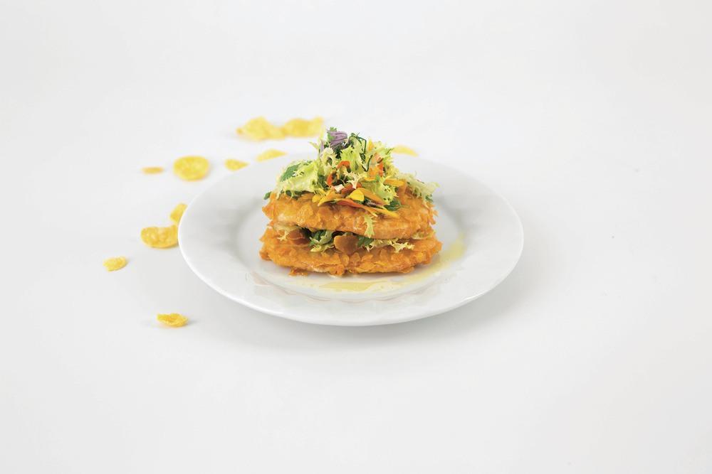 Celery cutlet baked in corn flakes with herb salad